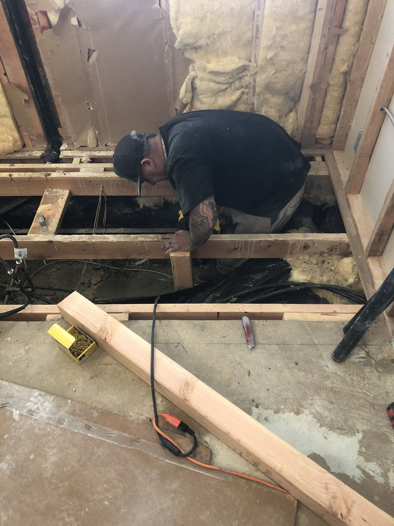 Shower build laying pipe