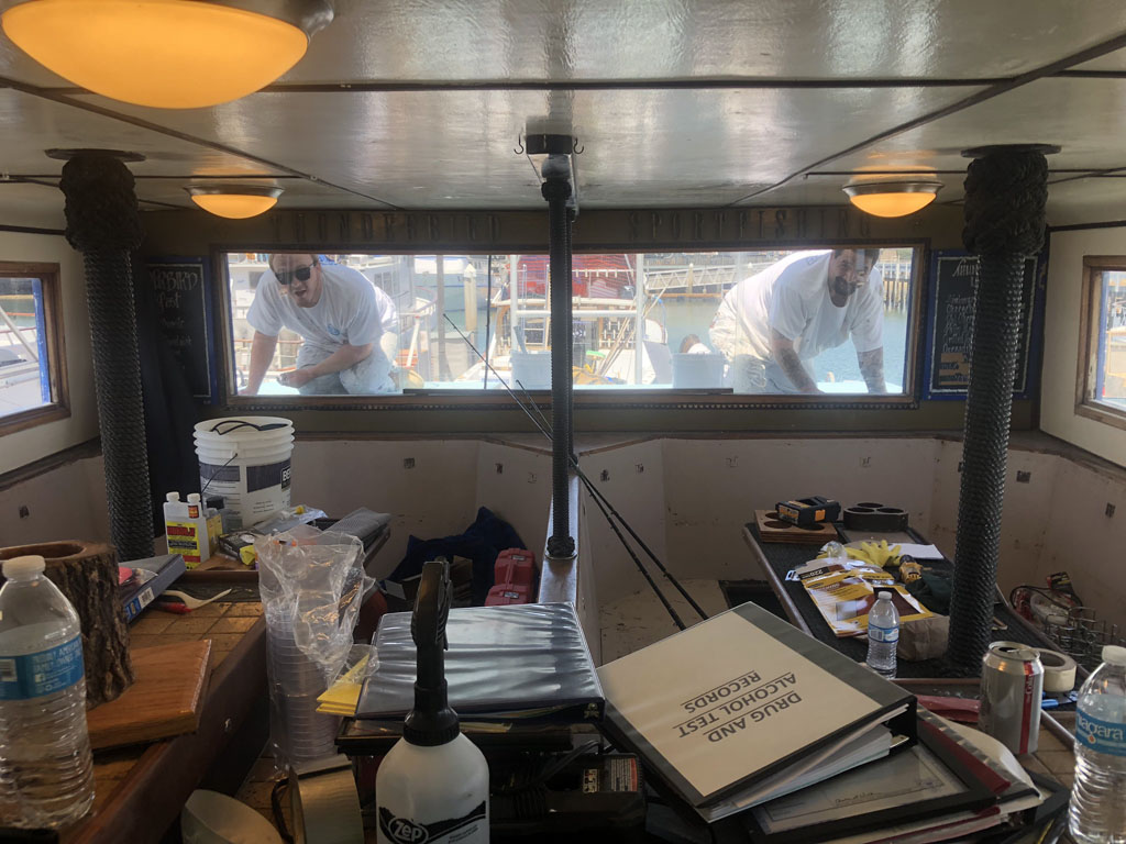 Painters painting boat