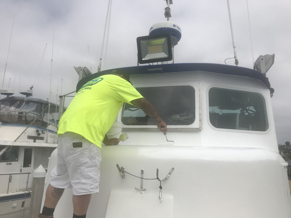 Painters painting boat