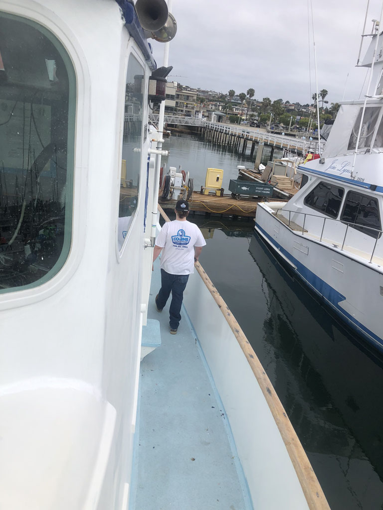 Painters painting boat