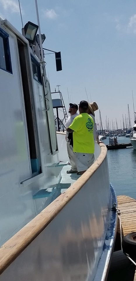 Painters painting boat